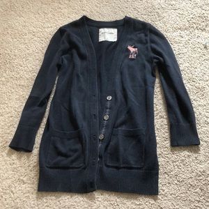 Navy Abercrombie sweater with pink detailing.